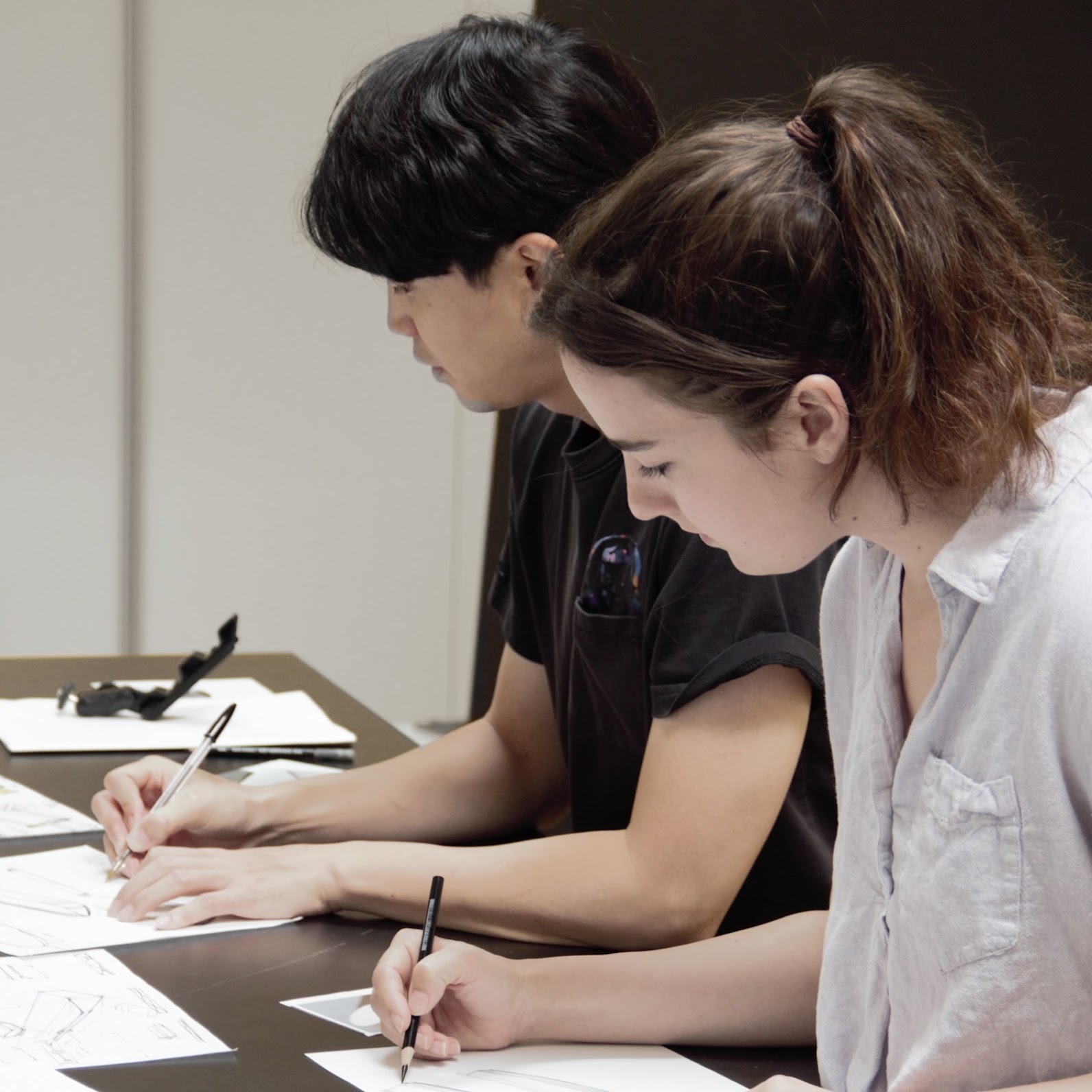 Huge Design team members sketching product concepts