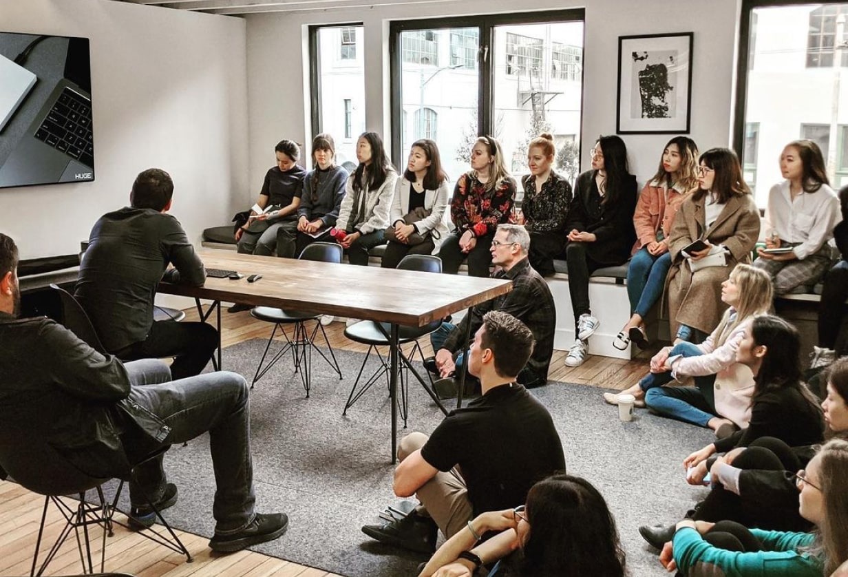 A group discussion at Huge Design’s studio