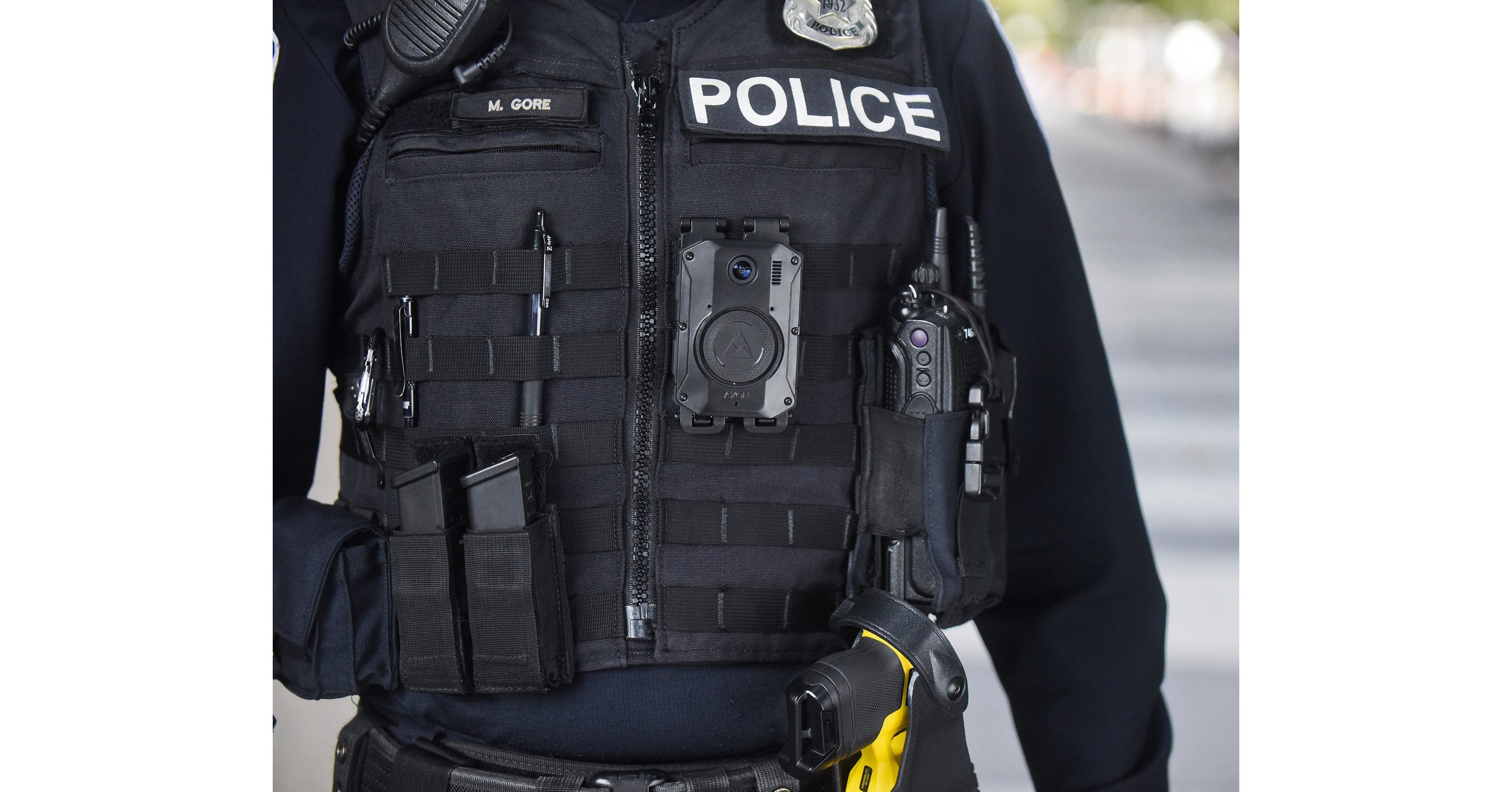 Axon Body 3 camera and holstered TASER on an officer’s uniform
