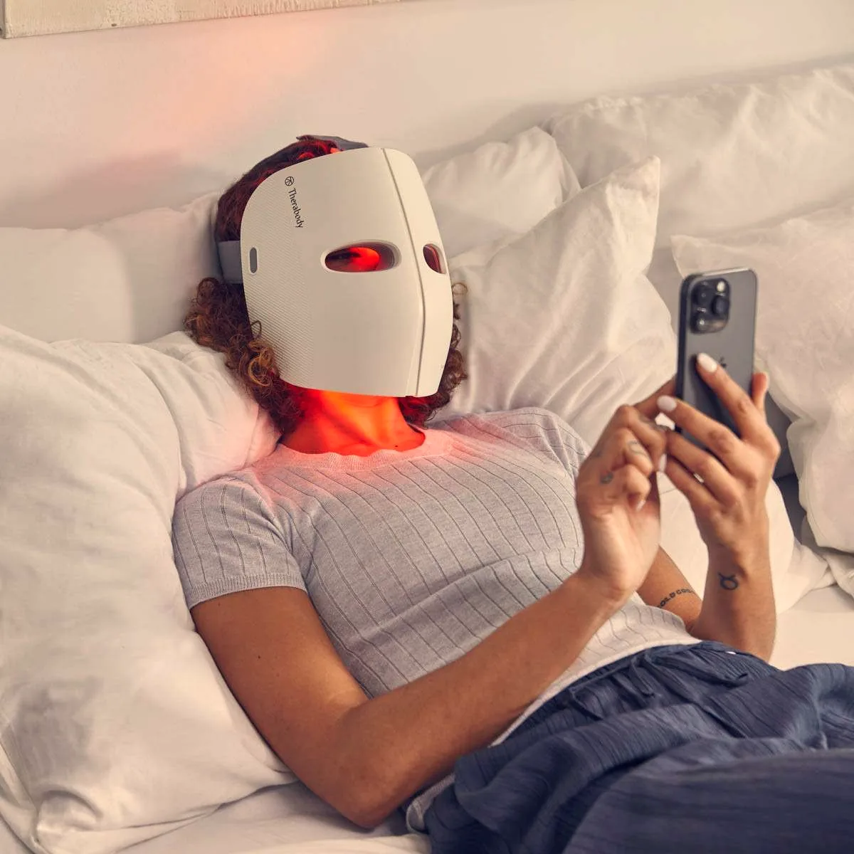 Therabody LED mask worn while relaxing at home