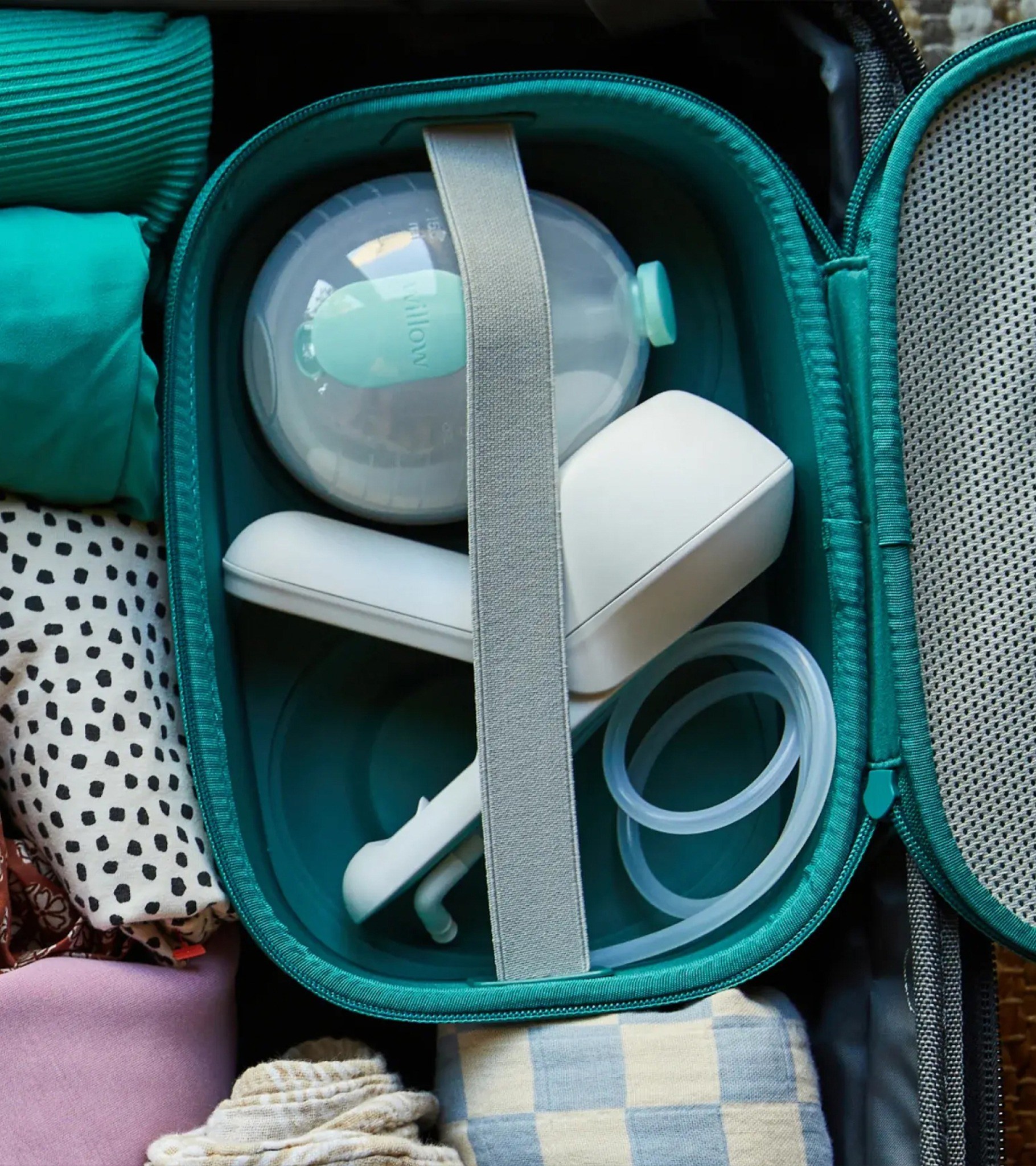Willow Wave pump, collection cup, and tubing packed into a travel case